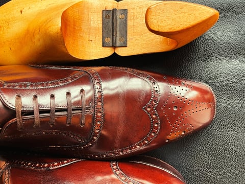 Worn leather shoes before repair